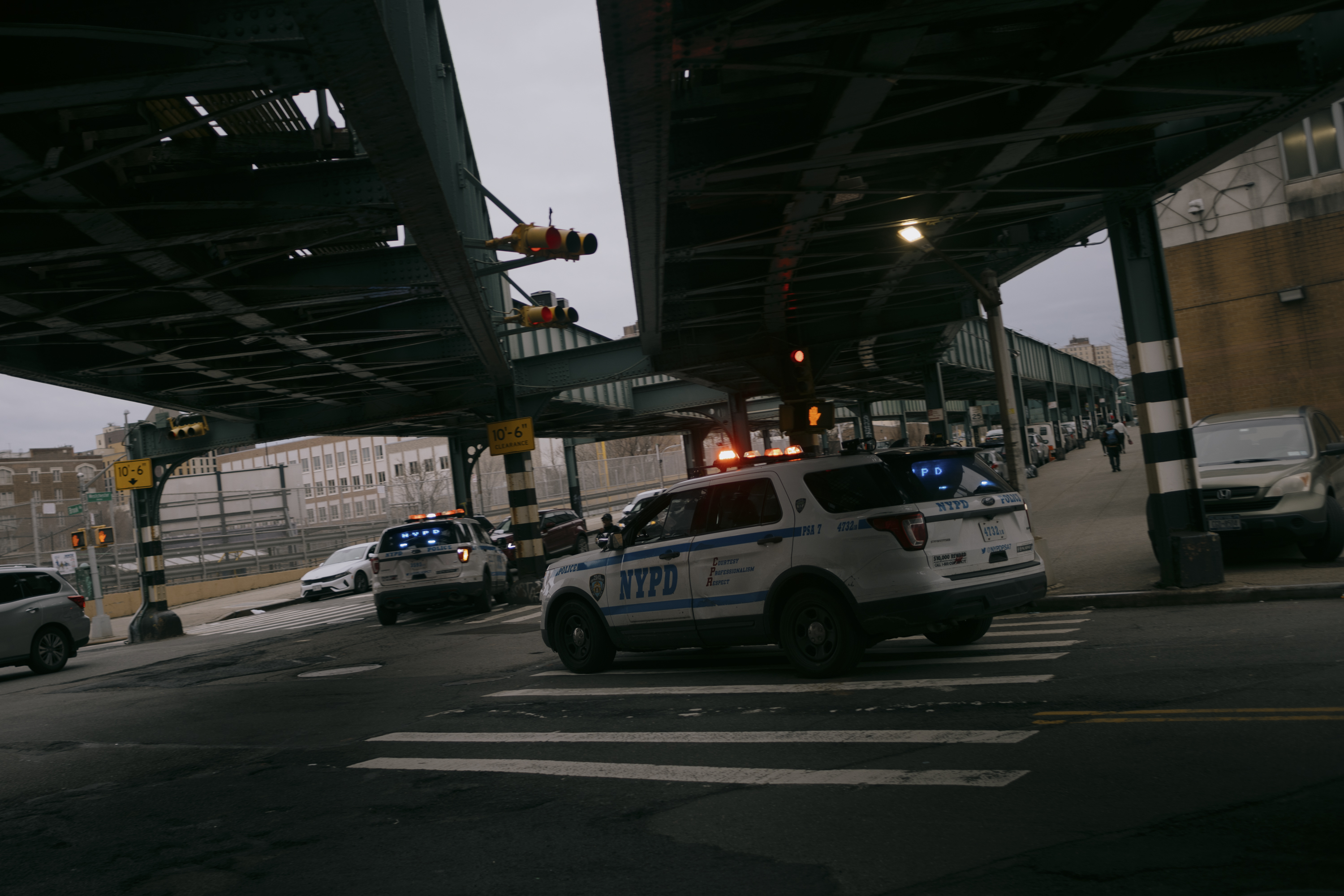 NYPD vehicles turn on Westchester Avenue in the Bronx on March 7, 2024.