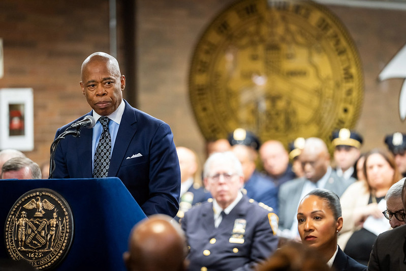 A photo of Mayor Eric Adams at a podium