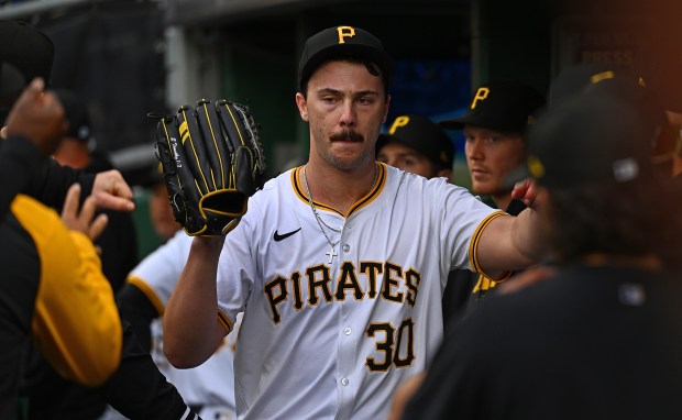 Pirates starter Paul Skenes high-fives teammates after being relieved in the fifth inning of his major-league debut against the Cubs on May 11, 2024, at PNC Park in Pittsburgh. (Justin Berl/Getty)