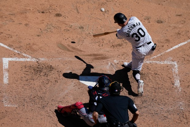 Chicago White Sox's Robbie Grossman hits a one-run double during the fifth inning of a baseball game against the Minnesota Twins in Chicago, Wednesday, May 1, 2024. (AP Photo/Nam Y. Huh)