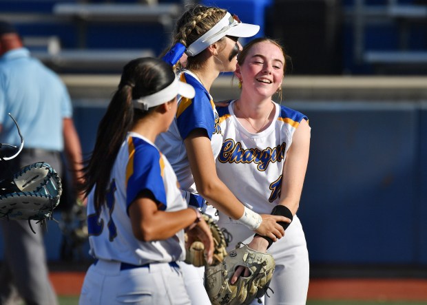 Aurora Central Catholic pitcher Corina Miller (right) shows relief after pitching her way out of a jam during the Class 2A Aurora Central Catholic Regional championship game against Richmond-Burton on Friday, May 17, 2024, in Aurora.(Jon Cunningham/for The Beacon-News)