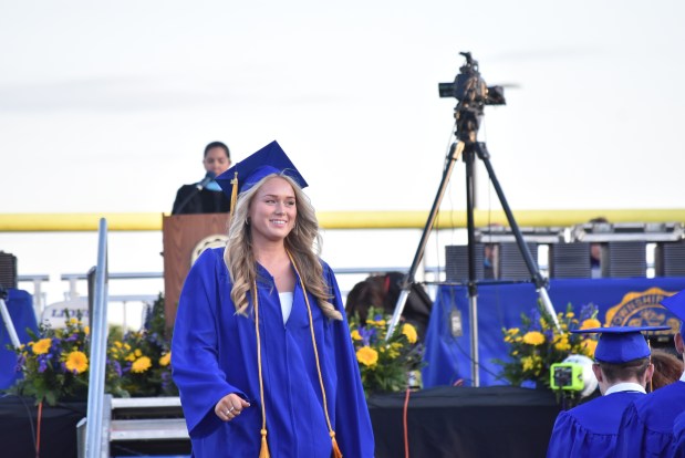 Class President Keira Petrusha exits the stage Wednesday after her remarks to graduates. (Jesse Wright)