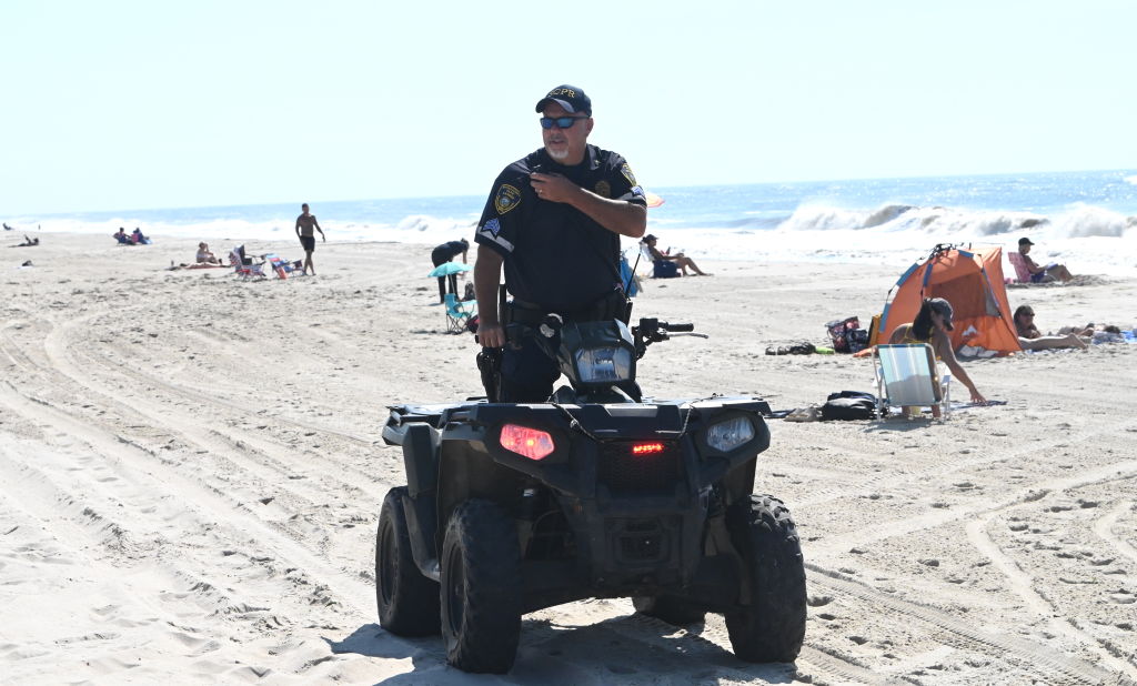 park ranger on an ATV patrolling a Long Island beach