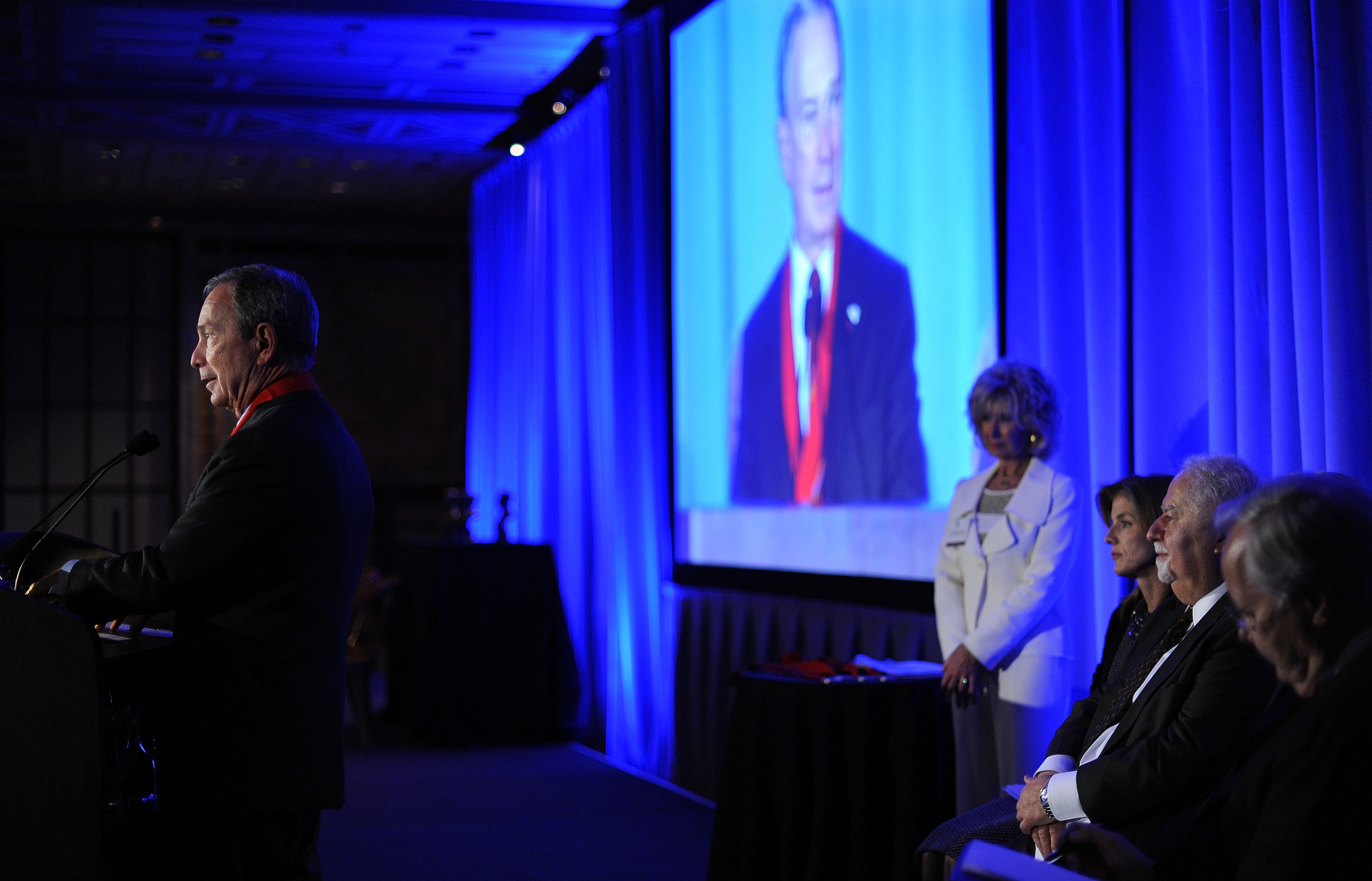 Michael Bloomberg with a medal around his neck