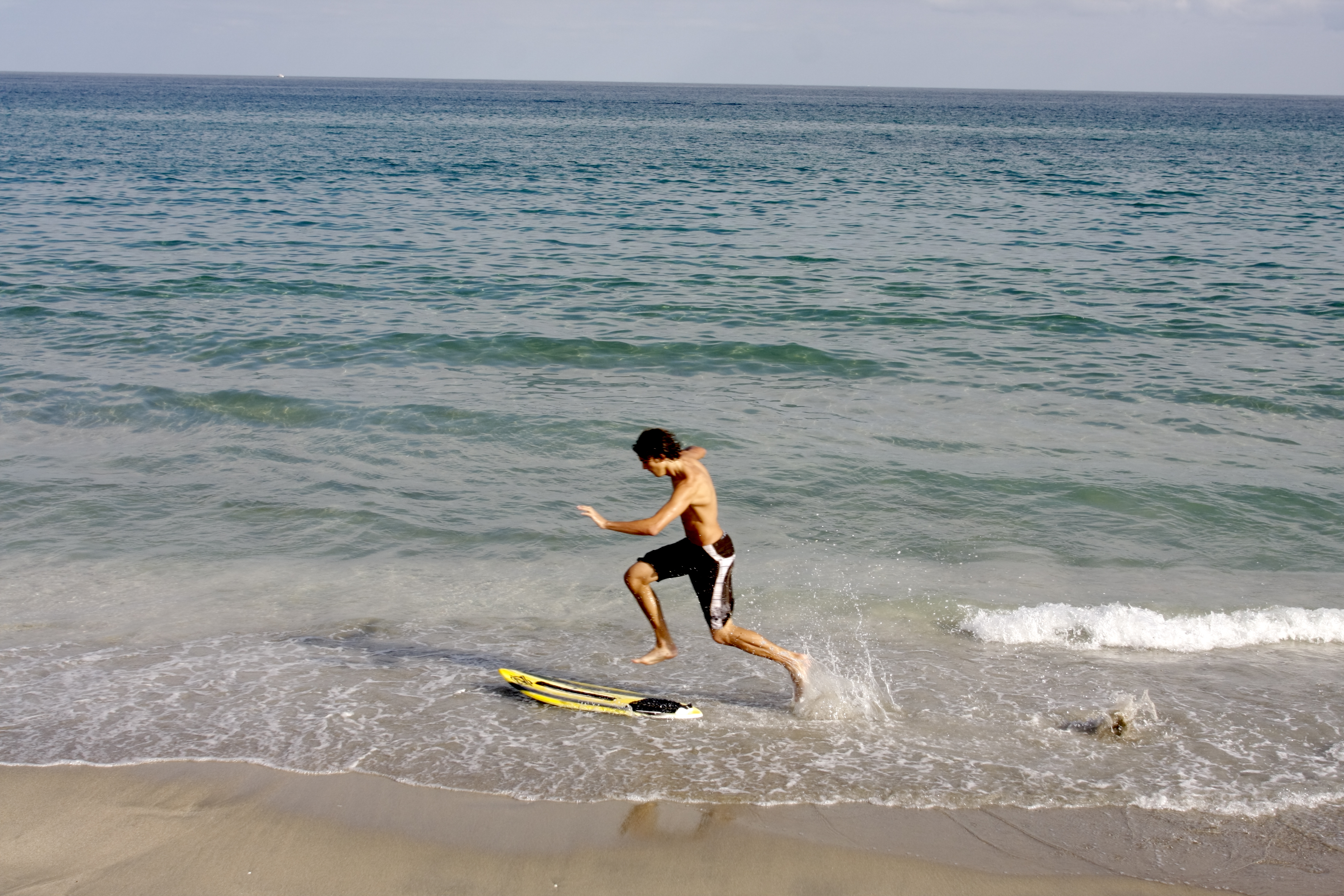 skimboarder on the beach