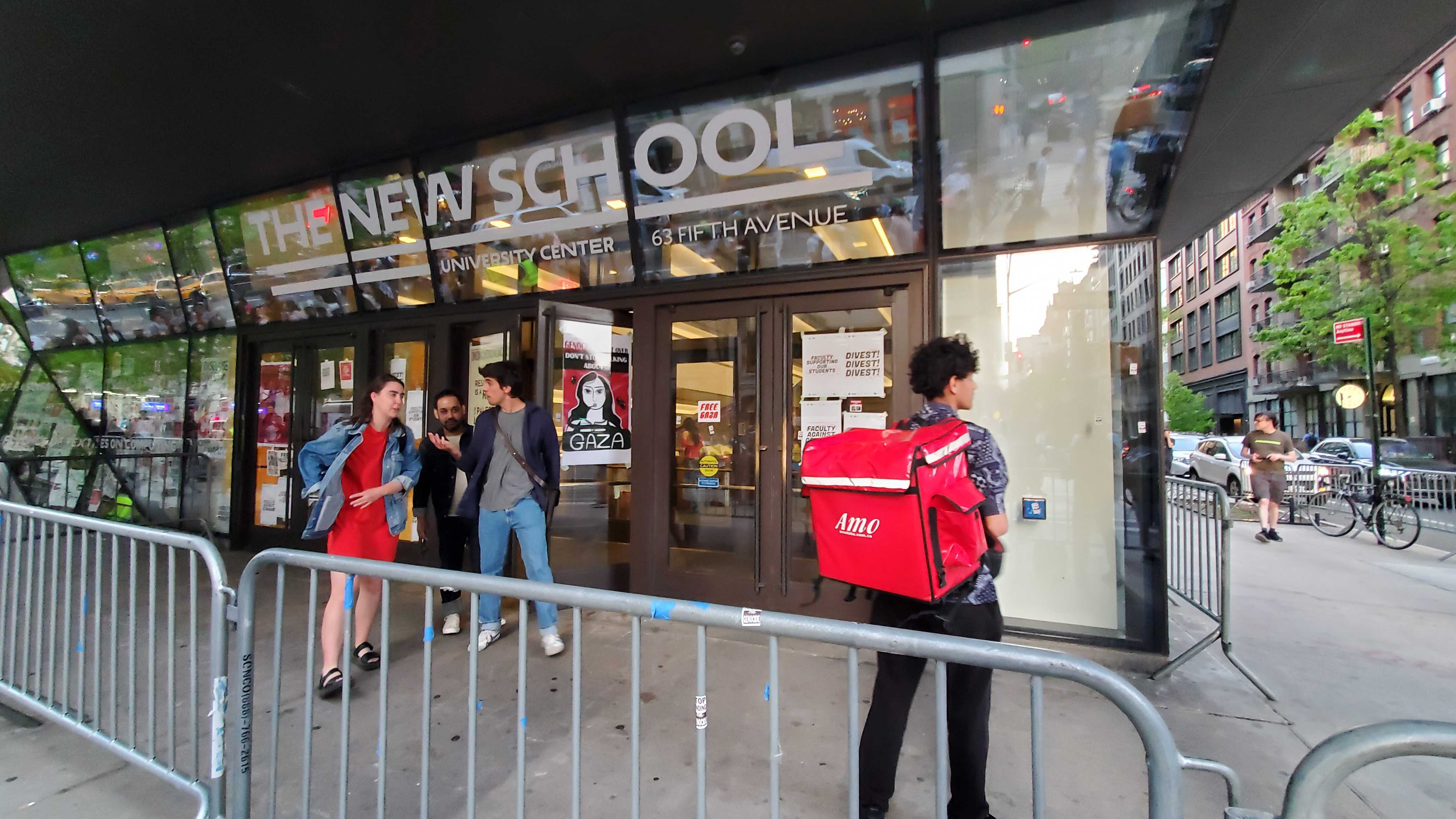 Students outside Manhattan's New School, which is surrounded by barricades.