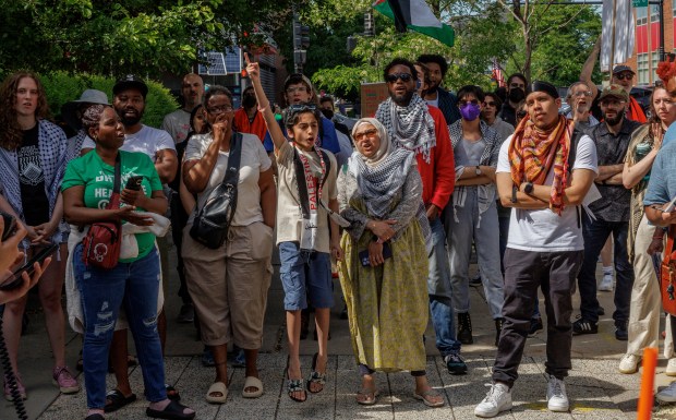 Protesters yell while attending a rally organized by the Coalition to March on the DNC near the Chicago police 18th District station, May 19, 2024 in Chicago. (Armando L. Sanchez/Chicago Tribune)