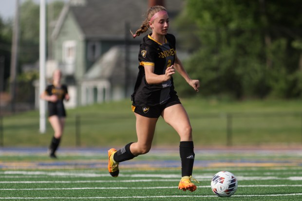 Andrew's Maxine Arvanetes (2) dribbles down field during the Class 3A Joliet Central Sectional semifinal game against Homewood-Flossmoor in Joliet on Tuesday, May 21, 2024. (Troy Stolt/for the Pioneer Press)