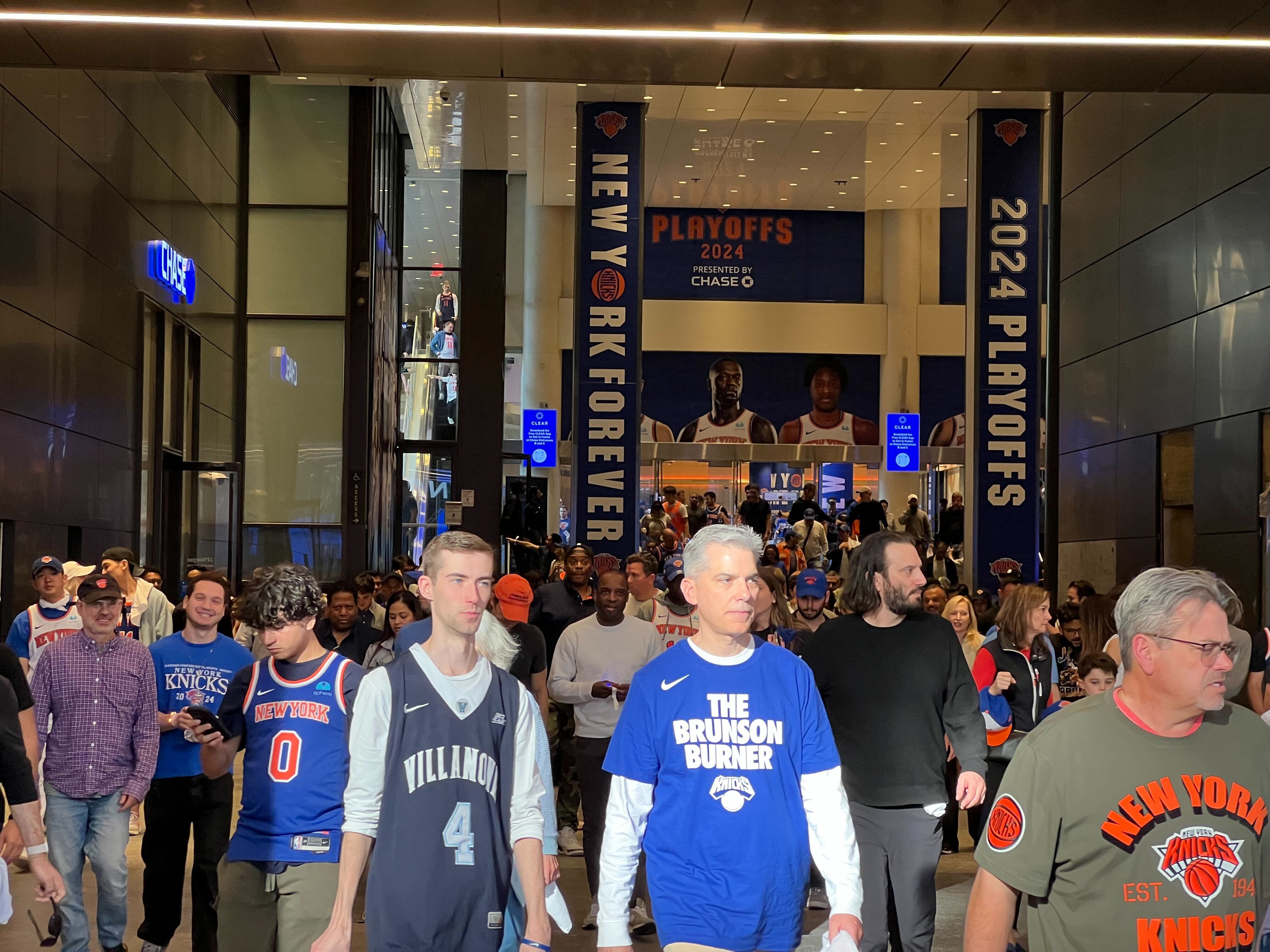 New York Knicks fans exit Madison Square Garden after seeing their team eliminated from the playoffs on Sunday.