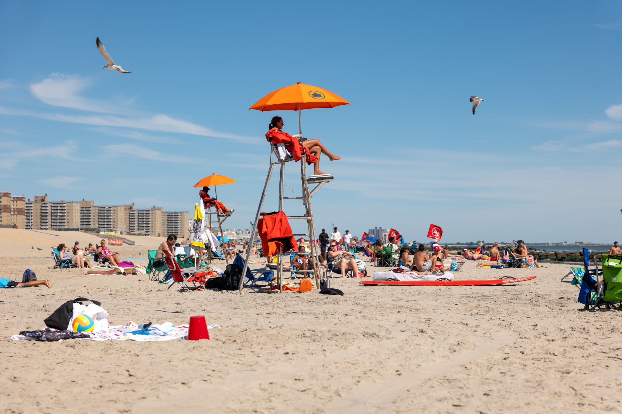 Lifeguards keep watch as the beach stands closed to swimmers at Rockaway Beach in New York.