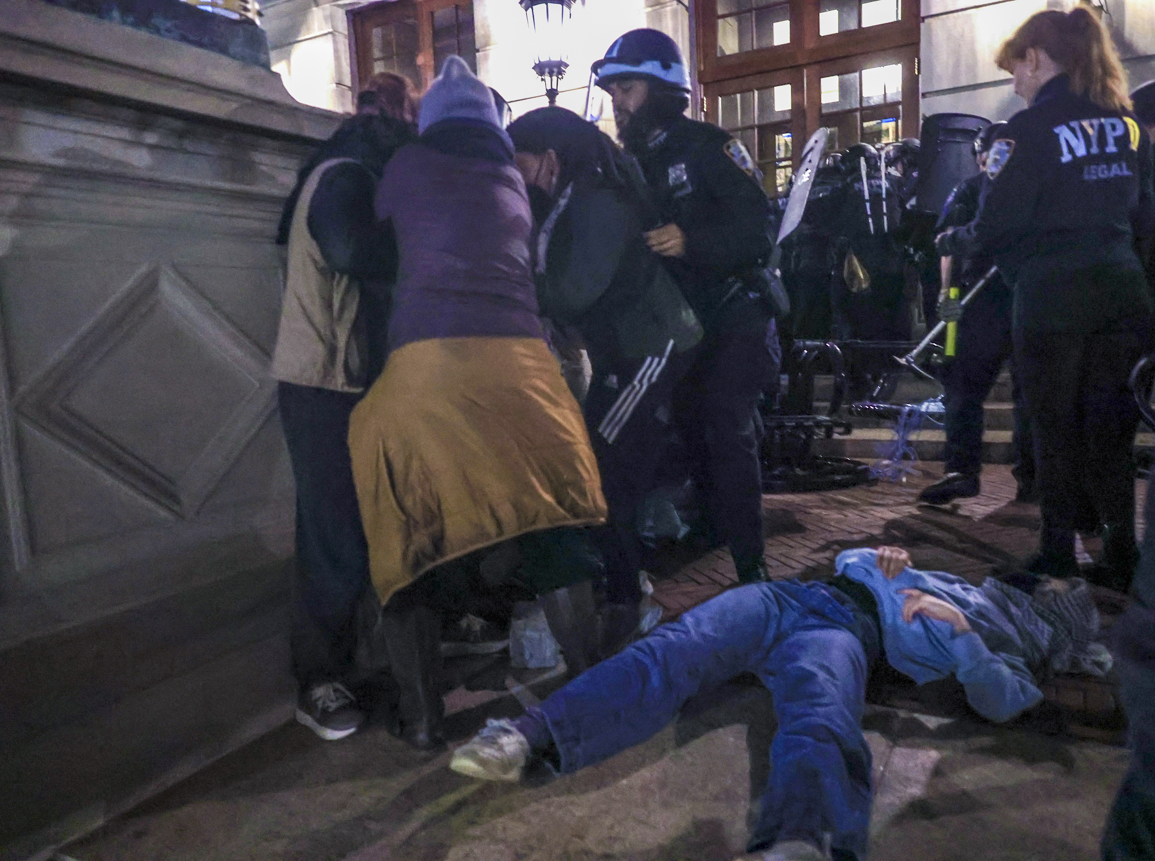 Dozens of students arrested at the occupied Hamilton Hall building of Columbia University in New York NEW YORK, UNITED STATES - APRIL 30: New York Police Department officers detain dozens of pro-Palestinian students at Columbia University after they barricaded themselves at the Hamilton Hall building near Gaza Solidarity Encampment earlier in New York, United States on April 30, 2024. (Photo by Selcuk Acar/Anadolu via Getty Images)