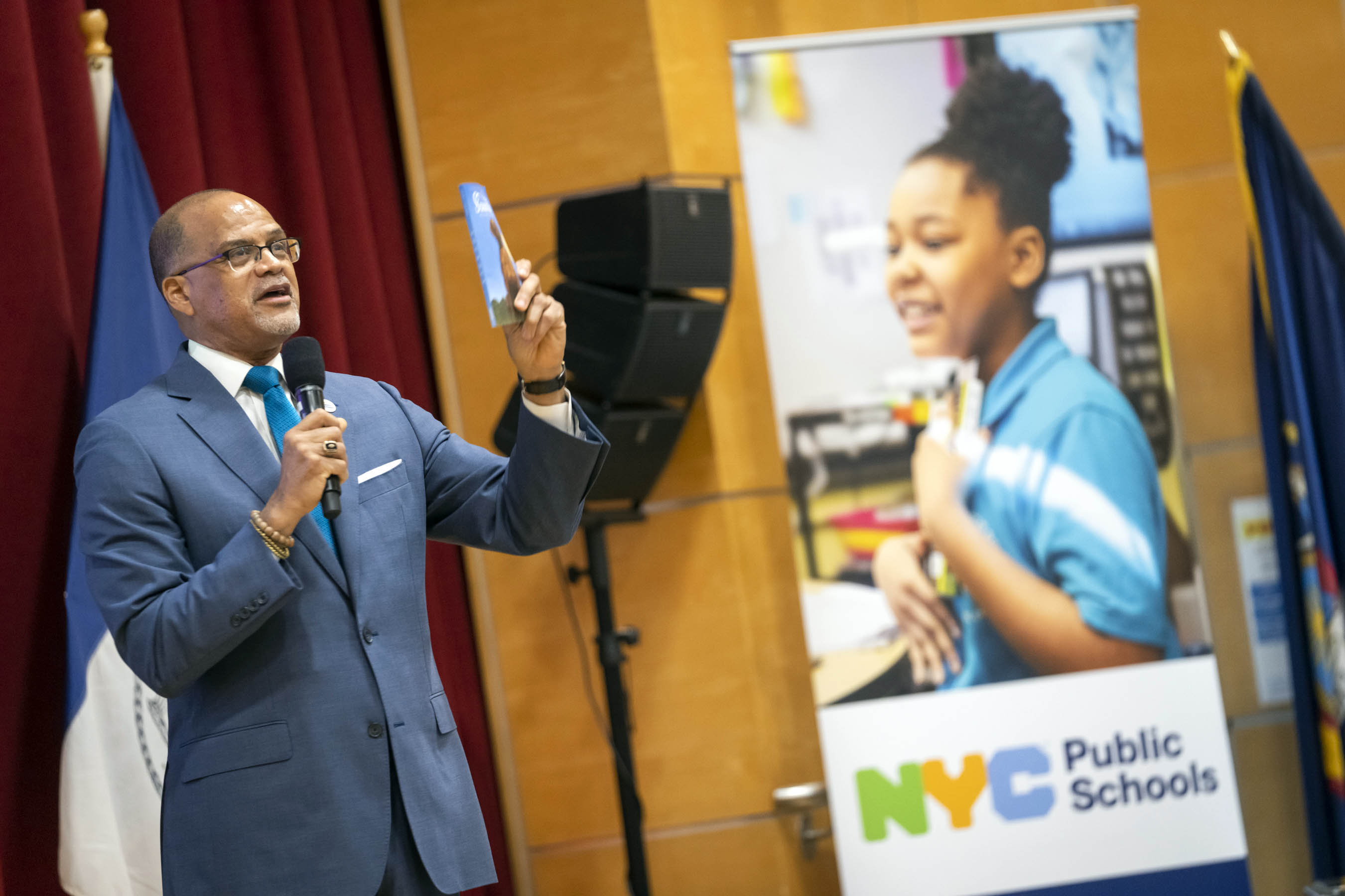 Schools Chancellor David Banks speaks in an auditorium.