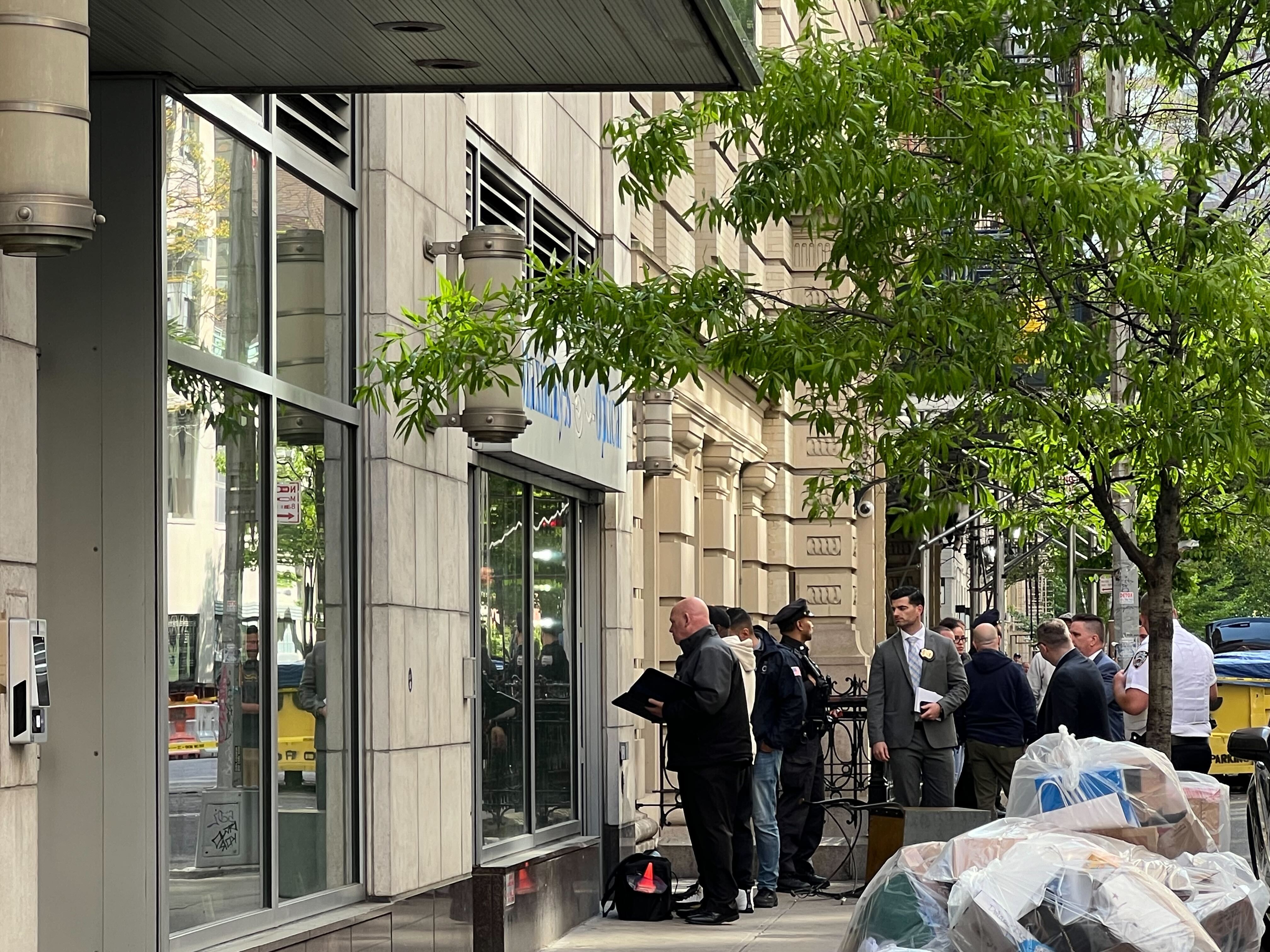 NYPD detectives investigate a shooting in Chelsea where police officials say officers shot a suspect on April 30, 2024.