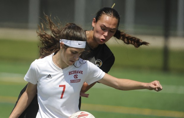 Metea Valley's Jessica Terada (24) defends Naperville Central's Bella Brozek (7) during the Class 3A Naperville Central Regional championship game Saturday, May 18, 2024 in Naperville, IL. (Steve Johnston/Naperville Sun)