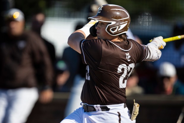 Mount Carmel's TJ McQuillan hits a single against Brother Rice to drive in the first run of the game in the Class 4A Reavis Sectional semifinal in Burbank on Wednesday, May 29, 2024. (Vincent D. Johnson/for the Daily Southtown)