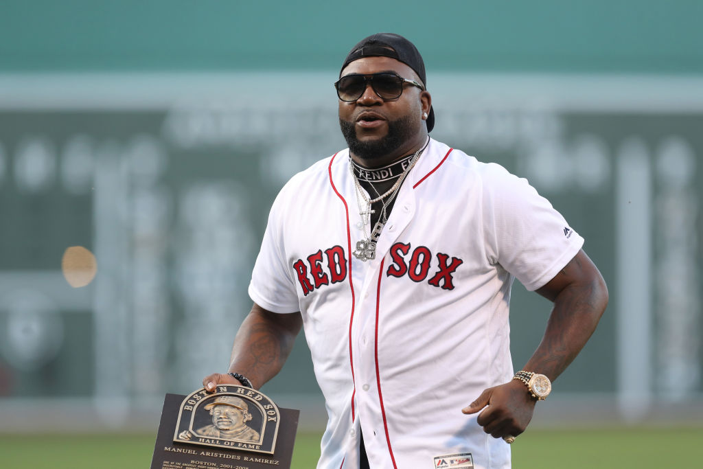 Former Boston Red Sox player David Ortiz, wearing a jersey, sunglasses and backwards hat.