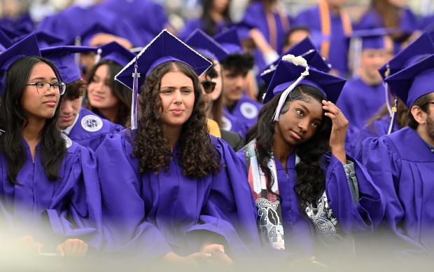 Front row. Graduation at Niles North High School on May 27, 2024 at Chuck Pos Stadium (9800 Lawler Ave.) in Niles. (Karie Angell Luc/Pioneer Press)