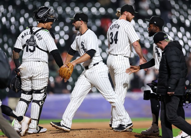 Chicago White Sox players L to R: Martín Maldonado, Paul DeJong, Michael Kopech, and Bryan Ramos, celebrate after a victory over the Cleveland Guardians at Guaranteed Rate Field in Chicago on May 9, 2024. (Chris Sweda/Chicago Tribune)