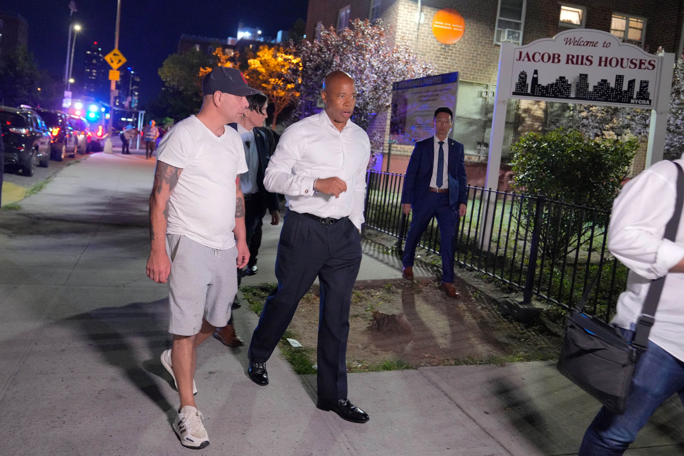 Mayor Eric Adams distributes water bottles at the New York City Housing Authority’s Jacob Riis Houses in Manhattan in 2022.