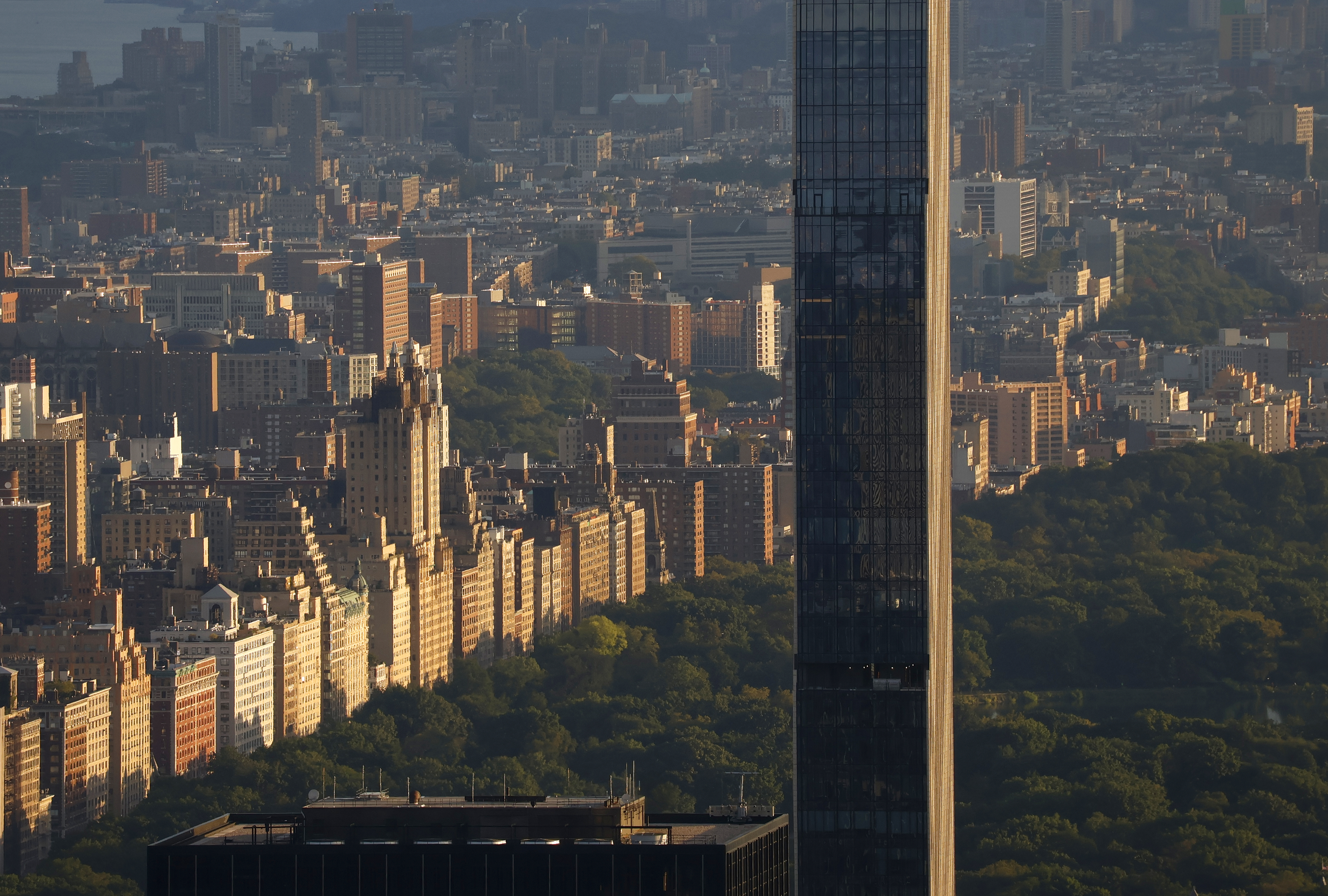 Buildings along the west side of Central Park are illuminated.