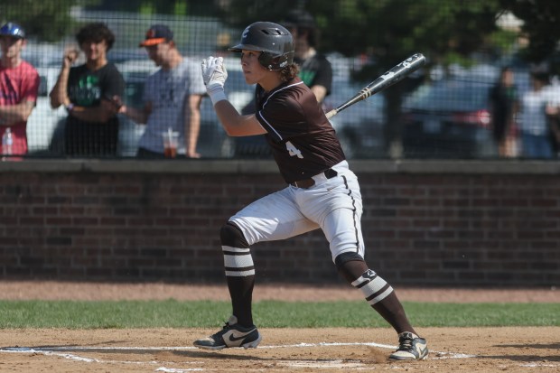 Mount Carmel's Timmy Harrigan (4) gets a hit during the Class 4A Reavis Regional semifinal against Oak Lawn in Burbank on Thursday, May 23, 2024. (Troy Stolt/for the Daily Southtown)