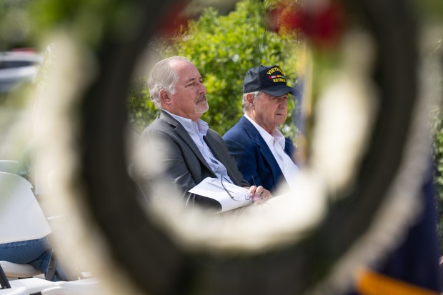 Veterans Bill Oeding, on left, and Jim Spanopoulos sit and listen during Valparaiso's Memorial Day event on Friday, May 24, 2024. (Kyle Telechan/for the Post-Tribune)