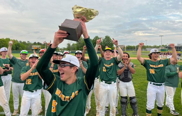 Waubonsie Valley's Ryan Morton (5) holds up the DuPage Valley Conference Tournament championship trophy after a 10-2 win over Naperville Central on Thursday, May 16, 2024. (Mark Black / Naperville Sun)