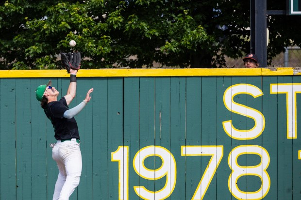 Providence's Mitch Voltz snags a hard hit Lincoln-Way West ball on the warning track during the Class 4A Providence Sectional final in New Lenox on Friday, May 31, 2024. (Vincent D. Johnson/for the Daily Southtown)