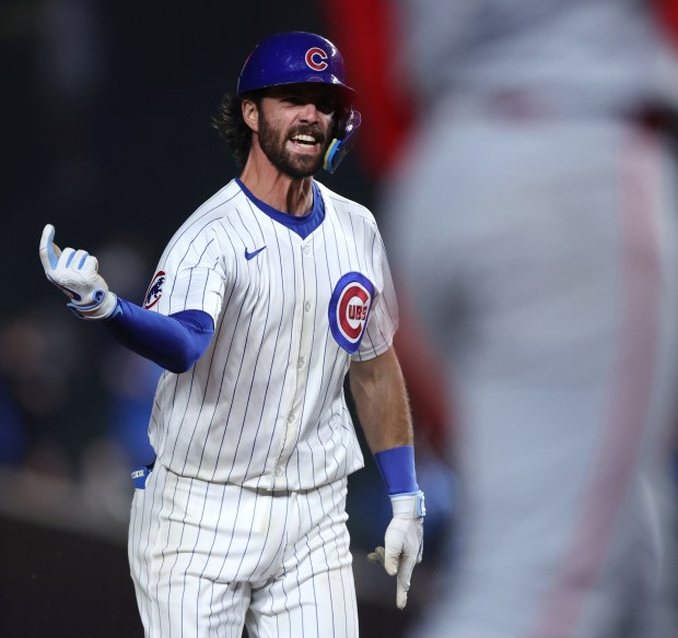 Chicago Cubs shortstop Dansby Swanson (7) celebrates as he rounds the bases after hitting a 2-run home run in the 8th inning of a game against the Cincinnati Reds at Wrigley Field in Chicago on June 2, 2024. (Chris Sweda/Chicago Tribune)