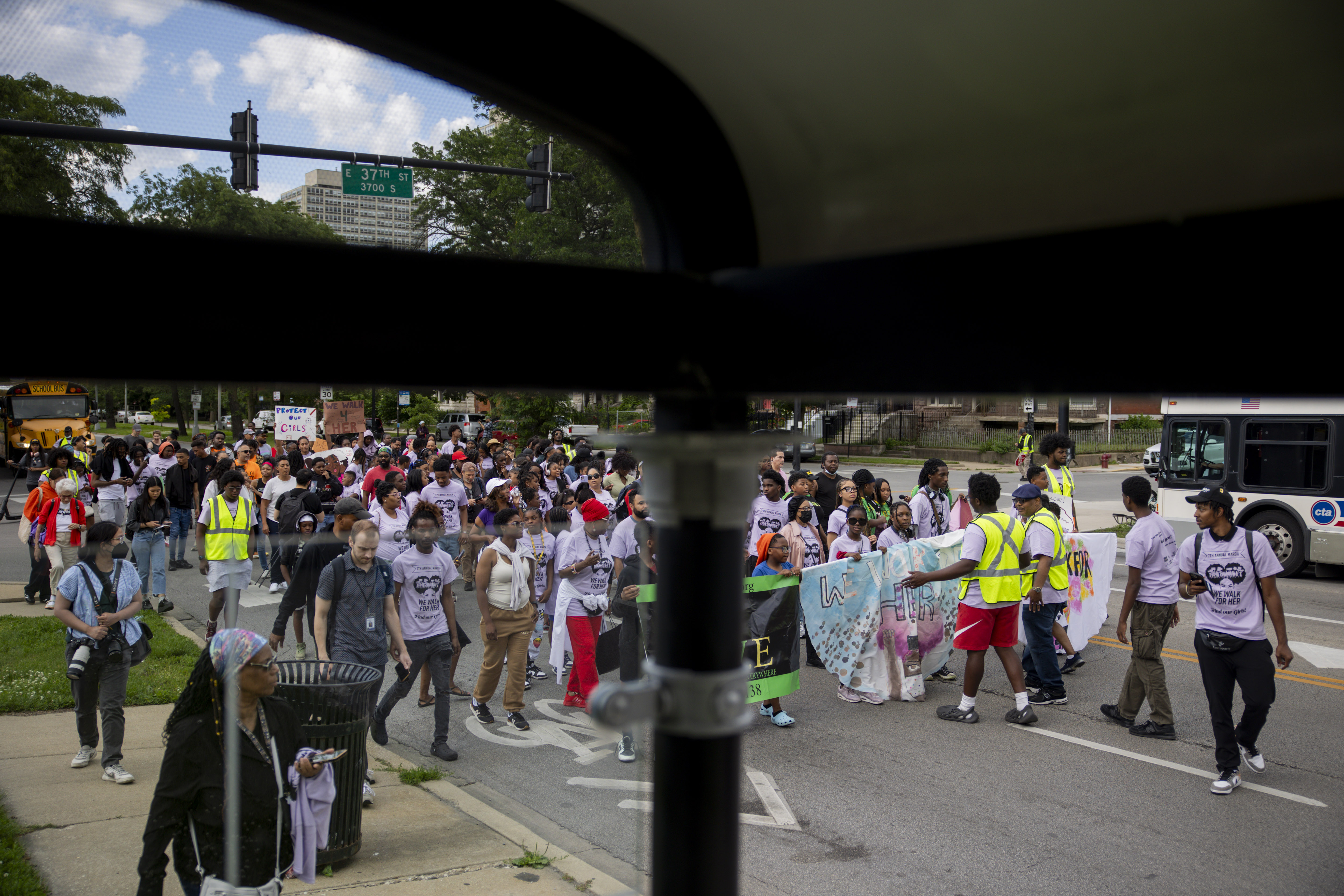 Community members march during the 7th annual “We Walk for...