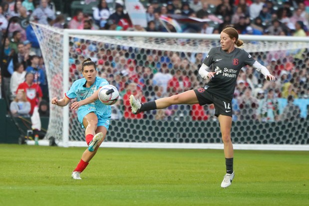 Chicago Red Stars midfielder Cari Roccaro (4) battles Bay FC Tess Boade for the ball during their game at Wrigley Field on June 8, 2024. (Eileen T. Meslar/Chicago Tribune)