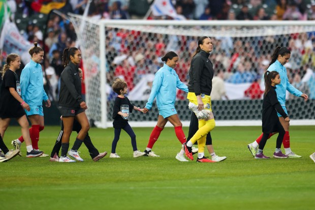 Chicago Red Stars forward Mallory Swanson and her teammates walk onto the field before their game against Bay FC at Wrigley Field on June 8, 2024. (Eileen T. Meslar/Chicago Tribune)