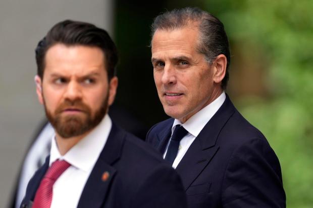 Hunter Biden, right, departs from federal court, Monday, June 10, 2024, in Wilmington, Del. (AP Photo/Matt Slocum)