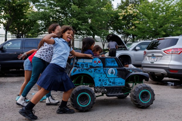 Children play near a migrant shelter on the Lower West Side on June 4, 2024, in Chicago. The city recently announced it would begin migrant shelter evictions for entire families. (Armando L. Sanchez/Chicago Tribune)