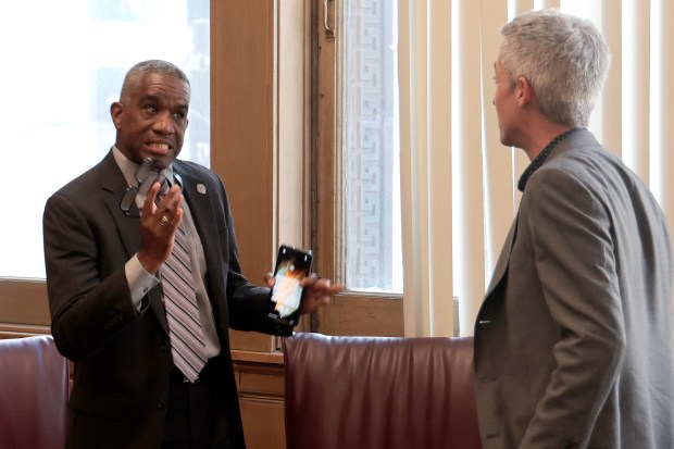 Ald. David Moore, left, and Ald. Daniel La Spata engage in a loud argument following the Chicago City Council meeting at City Hall on June 12, 2024. (Antonio Perez/Chicago Tribune)