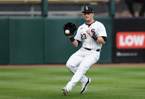 Chicago White Sox left fielder Andrew Benintendi (23) catches a ball that went for a double for Cincinnati Reds hitter Will Benson in the first inning of a game at Guaranteed Rate Field in Chicago on April 12, 2024. (Chris Sweda/Chicago Tribune)