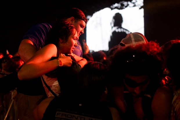 A festival goer is voluntarily removed by security from the pit due to overcrowding on Friday, June 14, 2024, at the Summer Smash Music Festival at SeatGeek Stadium in Bridgeview. (Vincent Alban/Chicago Tribune)