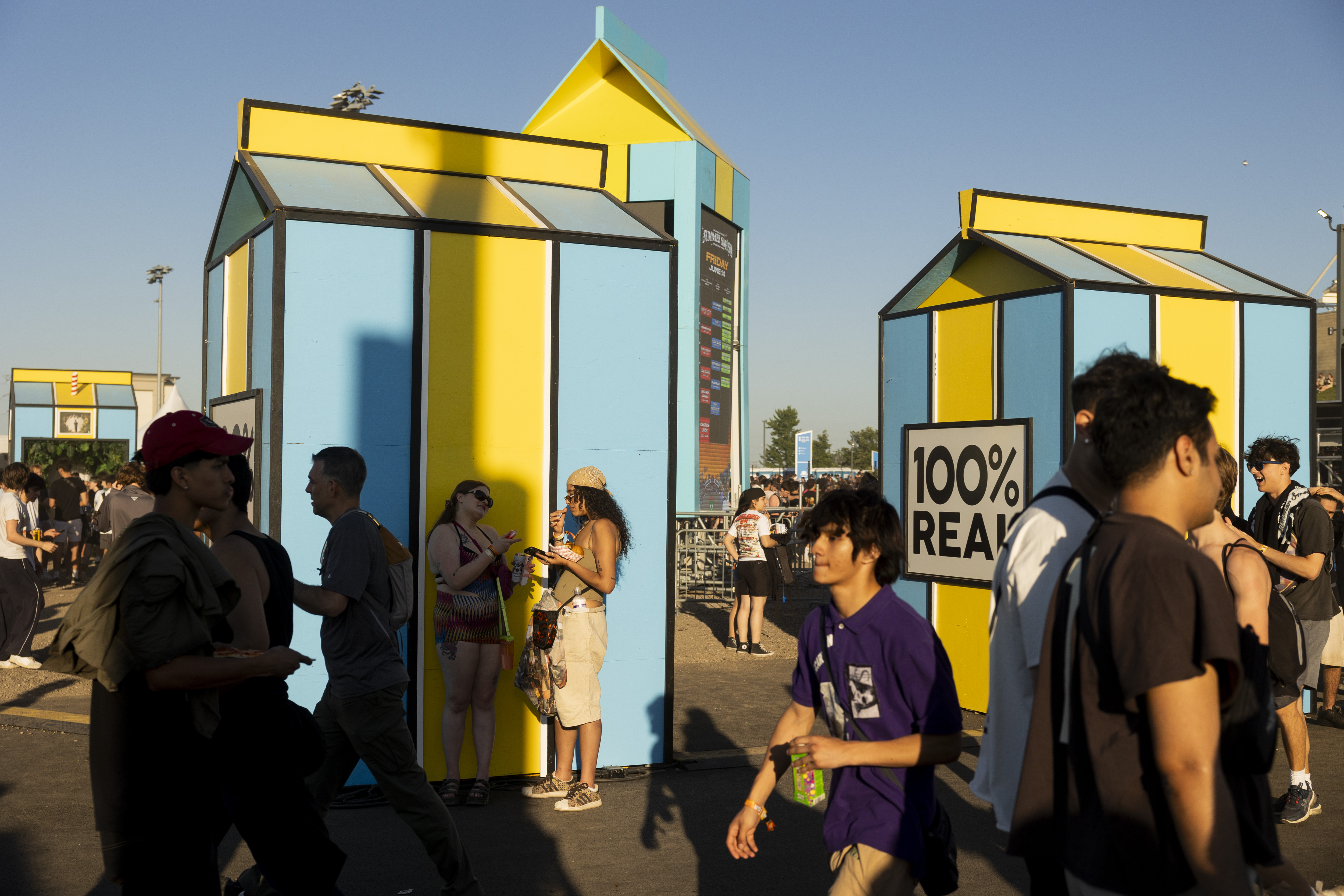 Festival attendees walk through the festival grounds on June 14, 2024, at the Summer Smash Music Festival at SeatGeek Stadium in Bridgeview.(Vincent Alban/Chicago Tribune)