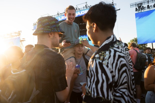 Jared Stanke sits on the shoulders of Griffin Kinny on June 14, 2024, at the Summer Smash Music Festival at SeatGeek Stadium in Bridgeview. (Vincent Alban/Chicago Tribune)