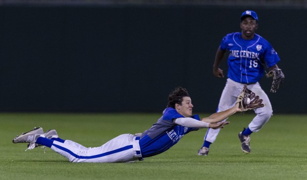 Lake Central's Nick Robinson (16) looks on as Michael Szatkowski (4) makes a diving grab in the 12th-inning against Mooresville in the Class 4A state championship game in Indianapolis on Saturday, June 15, 2024. (Vincent D. Johnson/for the Post-Tribune)