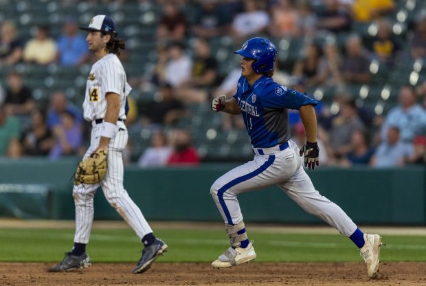 Lake Central's Griffin Tobias (1) makes his way to second on a double against Mooresville in the Class 4A state championship game in Indianapolis on Saturday, June 15, 2024. (Vincent D. Johnson/for the Post-Tribune)