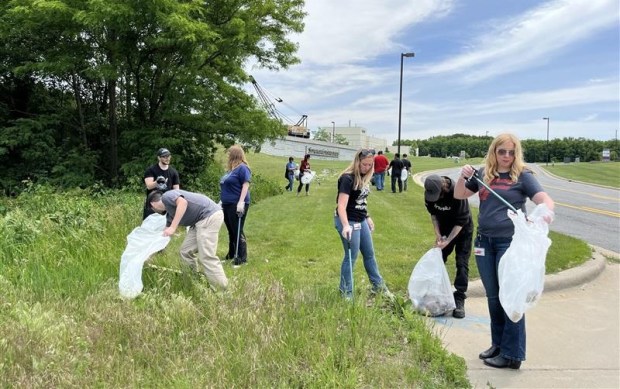 Fronius USA employees participated in a trail cleanup recently near its U.S. headquarters in Portage, engaging employees in a community hands-on sustainability effort, a release said. Employees volunteered their time to remove debris and improve trail conditions. (Photo courtesy of Fronius USA)