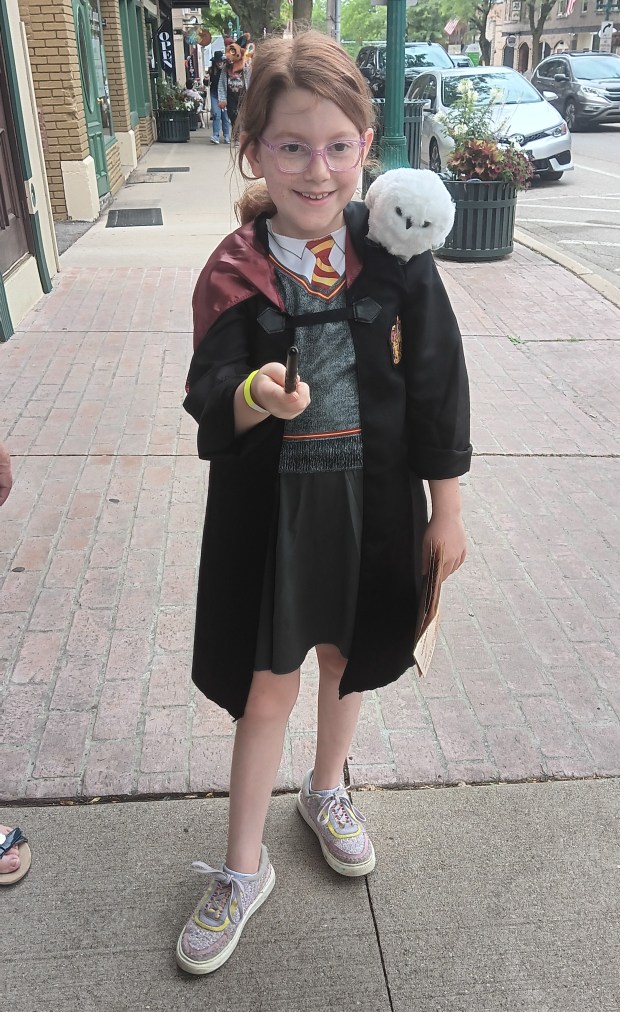 Phoebe Cohler ready to cast a spell, traveled with her parents from Brookfield to attend Wizards Weekend Day. (Gregory Harutunian/For the Lake County News-Sun)