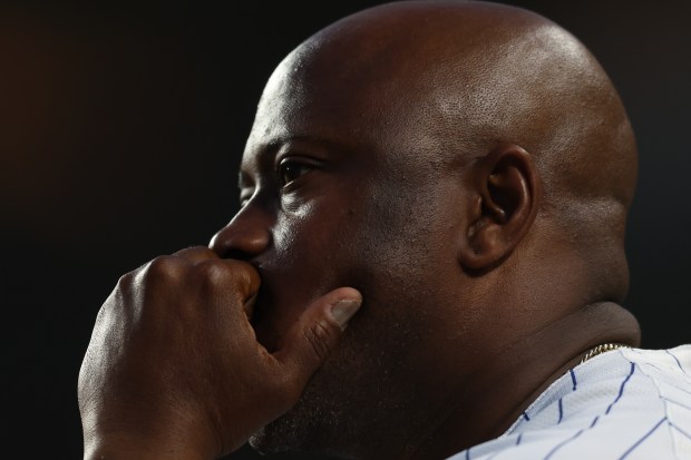 Chicago Cubs third base coach Willie Harris (33) watches the game from the dugout at Wrigley Field on June 17, 2024, in Chicago. (Stacey Wescott/Chicago Tribune)