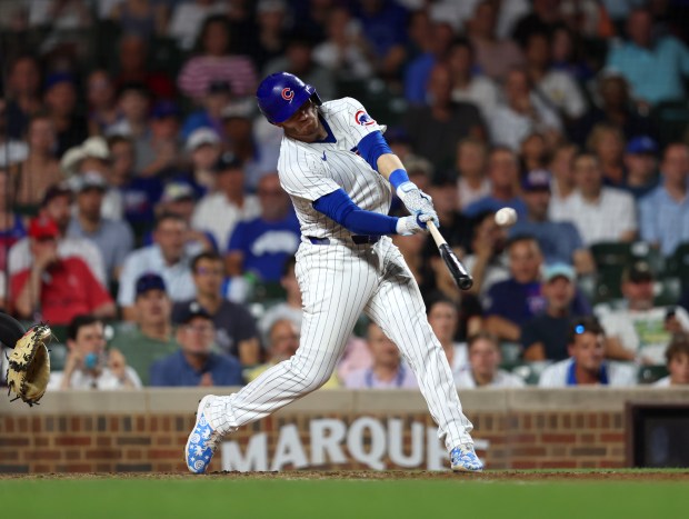 Chicago Cubs outfielder Ian Happ (8) hits a three-run homer in the bottom of the seventh inning during a game against the San Francisco Giants at Wrigley Field on June 17, 2024, in Chicago. Happ's homer put the Cubs ahead 6-3 but the lead did not hold. The Giants beat the Cubs 7-6. (Stacey Wescott/Chicago Tribune)