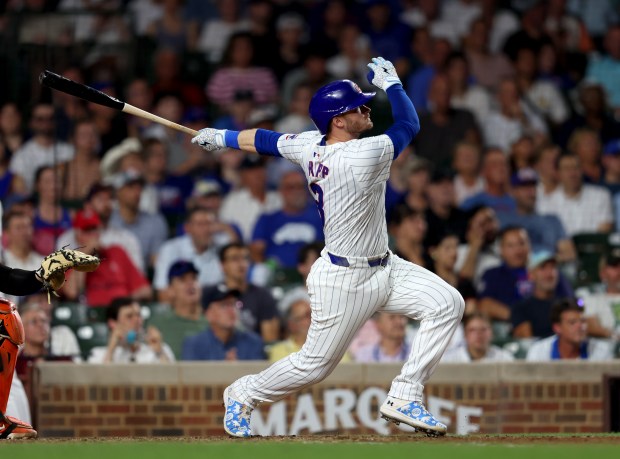 Chicago Cubs outfielder Ian Happ (8) hits a three-run homer in the bottom of the seventh inning during a game against the San Francisco Giants at Wrigley Field on June 17, 2024, in Chicago. Happ's homer put the Cubs ahead 6-3 but the lead did not hold. The Giants beat the Cubs 7-6. (Stacey Wescott/Chicago Tribune)