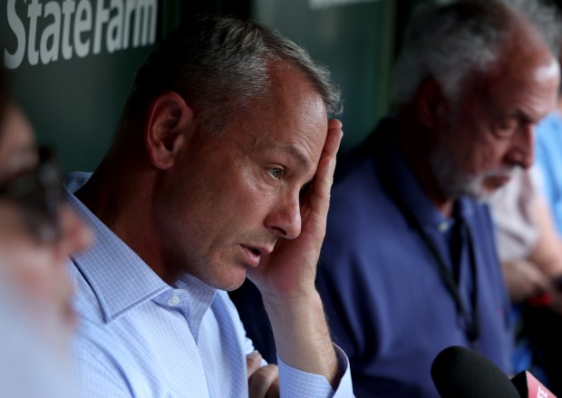 Chicago Cubs general manager Jed Hoyer speaks with the media in the Cubs dugout on a hot and humid 95 degree day before the start of a game between the Chicago Cubs and San Francisco Giants at Wrigley Field on June 16, 2024, in Chicago. (Stacey Wescott/Chicago Tribune)