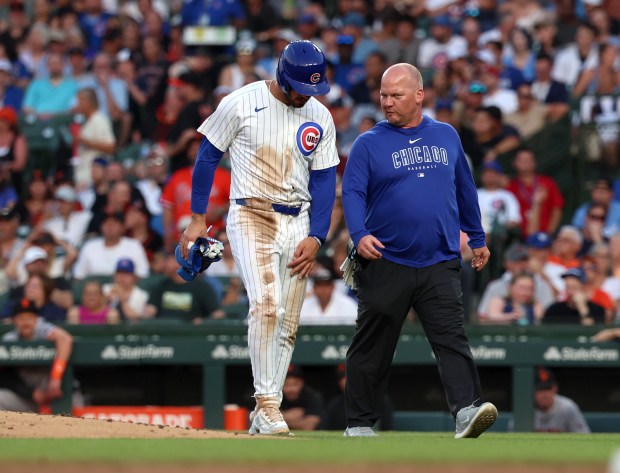 Chicago Cubs designated hitter Mike Tauchman (40) leaves the game with left groun tightness in the bottom of the third inning against the San Francisco Giants at Wrigley Field on June 16, 2024, in Chicago. (Stacey Wescott/Chicago Tribune)