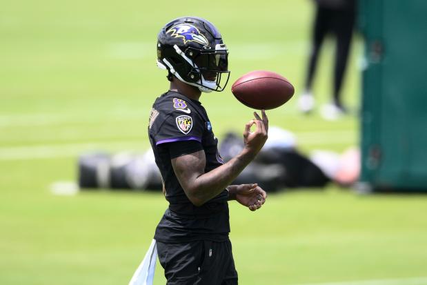Ravens quarterback Lamar Jackson spins the football on his finger during practice on June 11, 2024, in Owings Mills, Md. (AP Photo/Nick Wass)