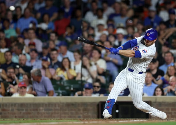 Chicago Cubs first baseman Michael Busch hits a double in the 8th inning of a game against the San Francisco Giants at Wrigley Field in Chicago on June 18, 2024. (Chris Sweda/Chicago Tribune)